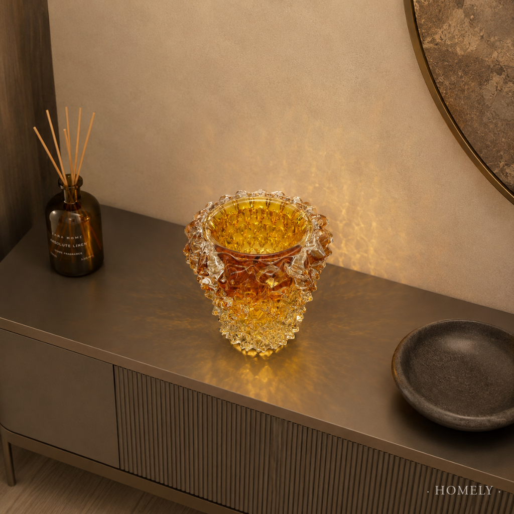 Decorative glass vase on a shelf with a diffused light background