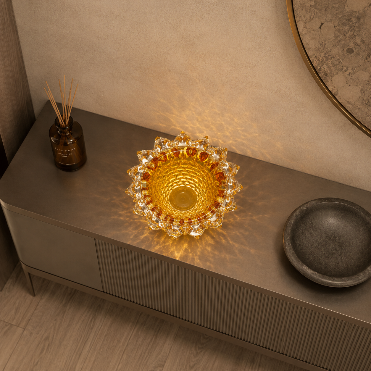 Decorative glass bowl on a wooden surface with a warm glow