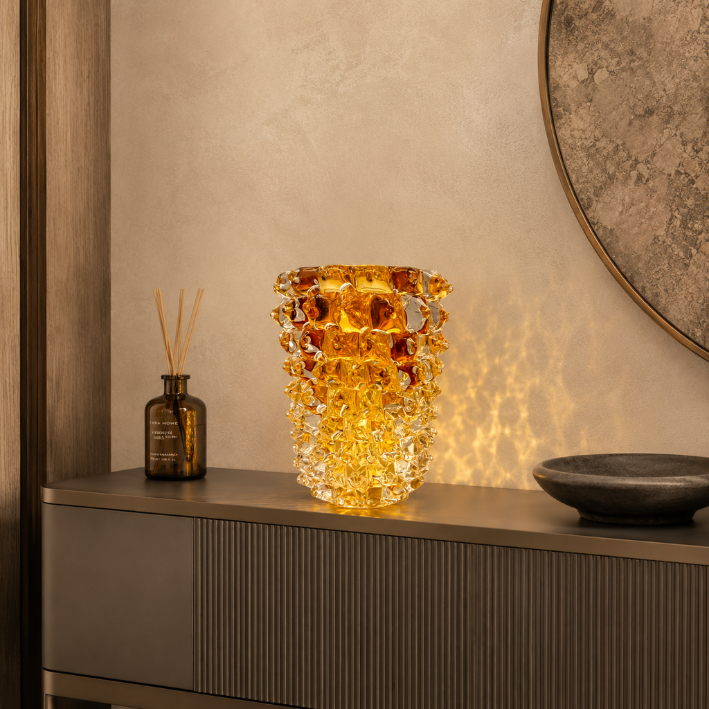 Decorative glass vase on a shelf with a diffused light source
