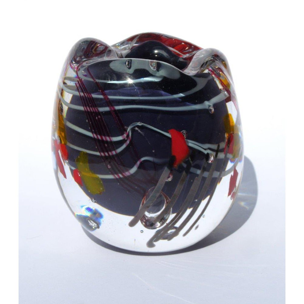 Colorful glass object with abstract design on a white background