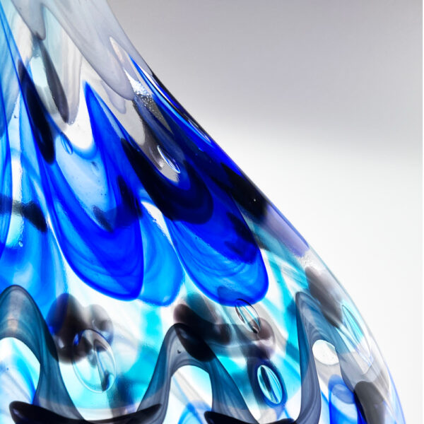 Close-up of a blue and black abstract design on a white background