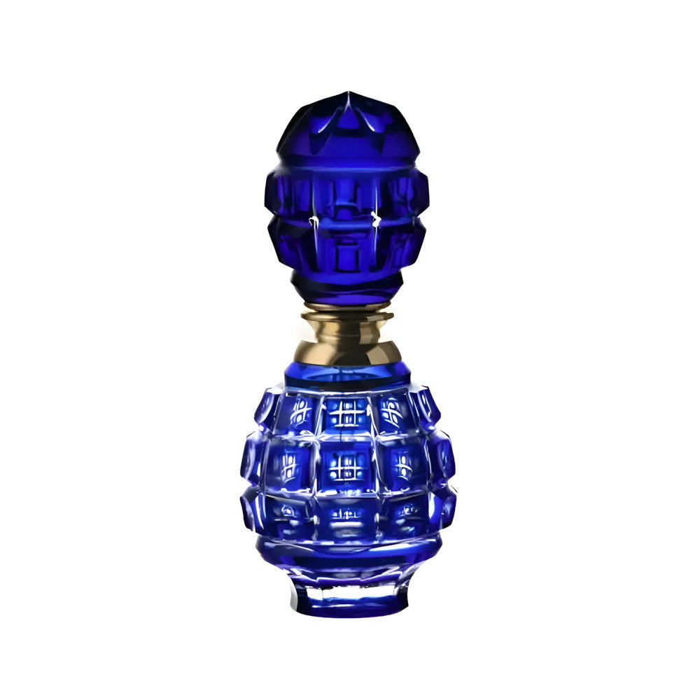 Blue glass bottle with intricate design on a white background