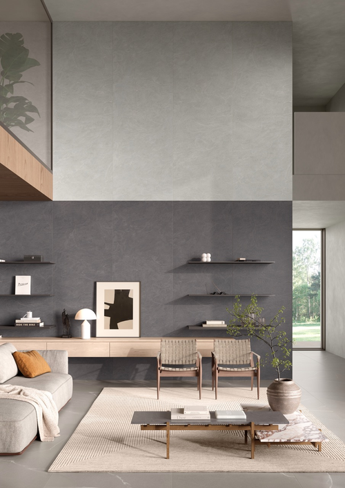 Modern living room with gray walls, wooden furniture, and decorative elements.