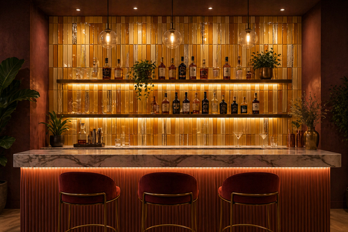 Modern bar with wooden shelves, bottles, and a counter with chairs.