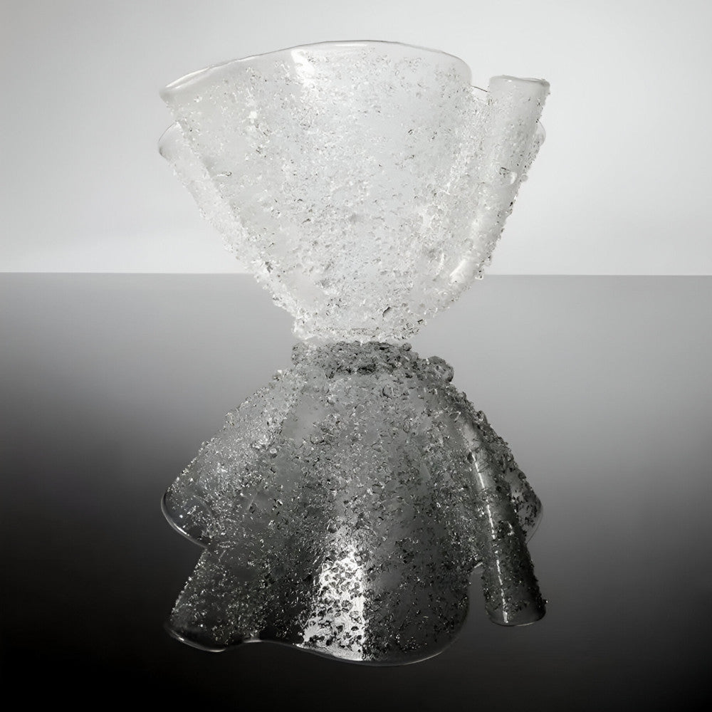 Glass vase with textured surface on a gradient background