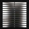 Metallic rectangular tiles arranged in a grid pattern on a black background