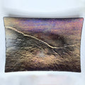 Textured rectangular object with a gradient of colors on a white background