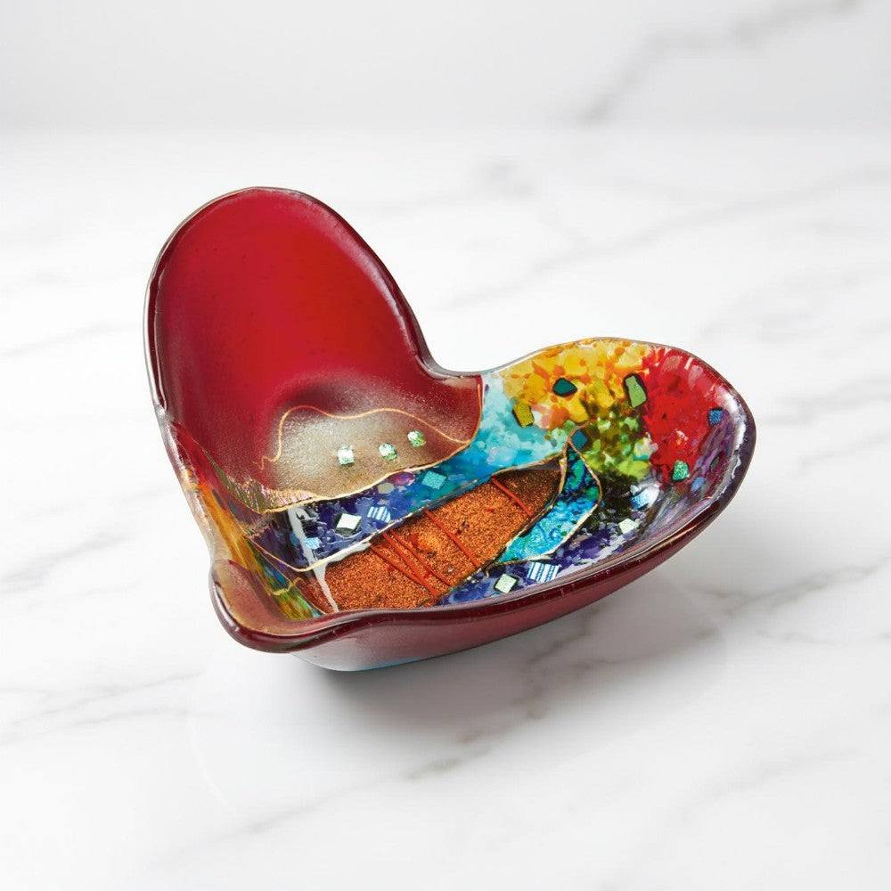 Heart-shaped decorative item with multicolored design on a white background
