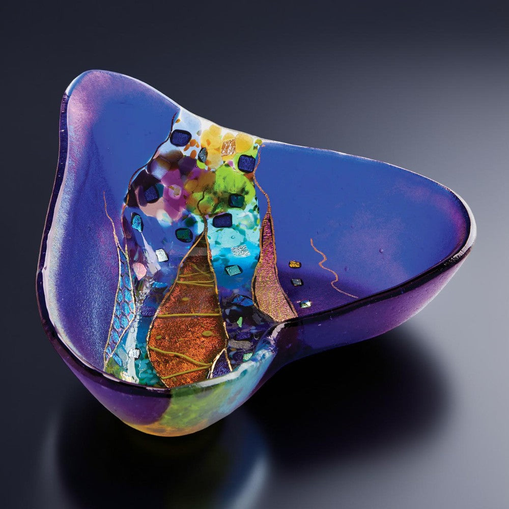 Colorful glass sculpture on a dark background