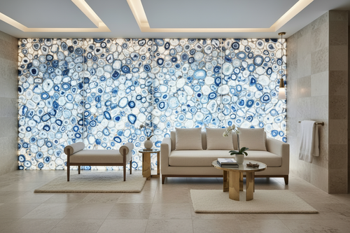Modern living room with beige sofa, armchair, and coffee table against a decorative wall with blue and white circular patterns.