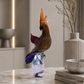 Decorative glass Cockatoo sculpture on a marble surface with a neutral background