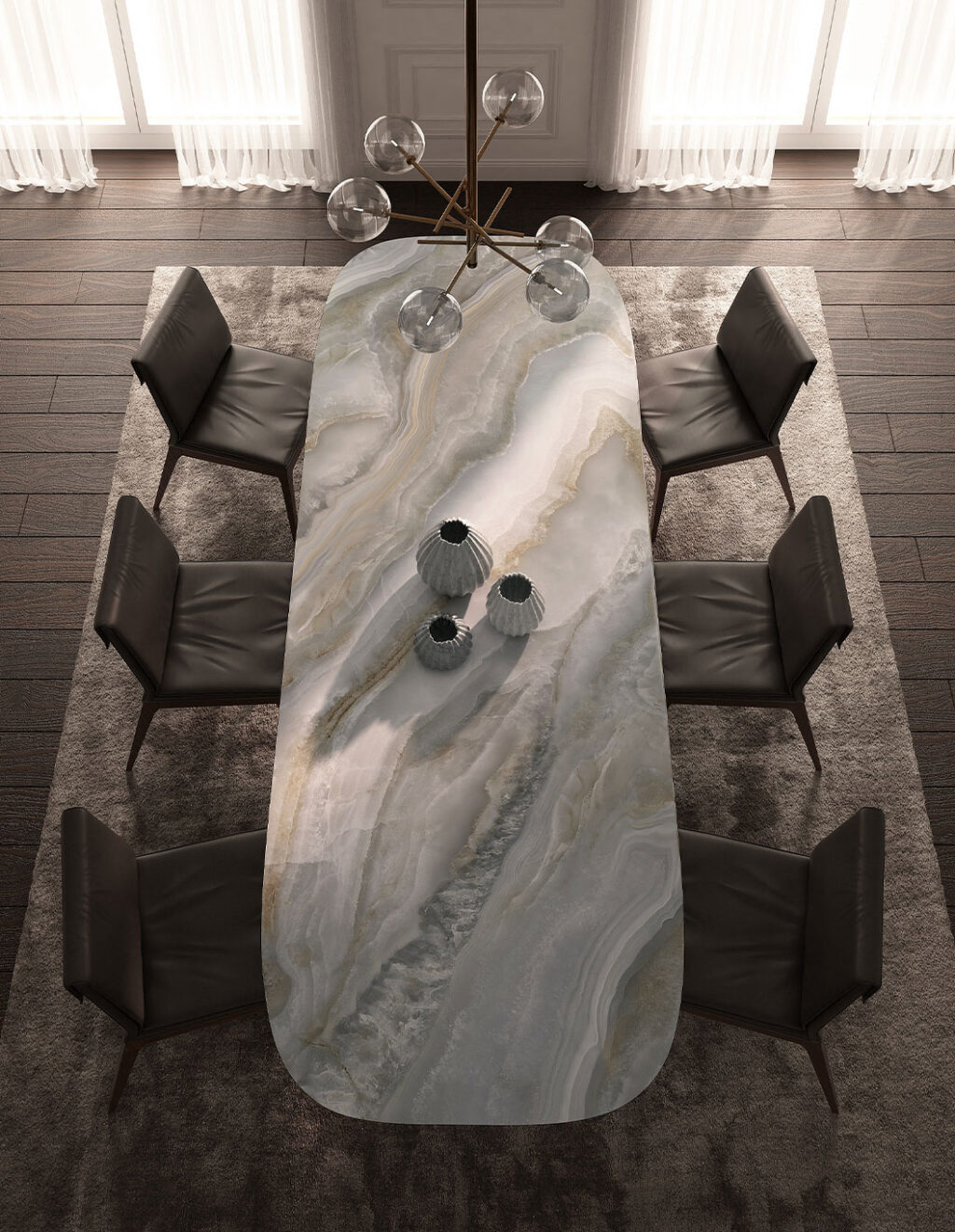 Dining room with a marble table and modern chairs in a well-lit room.