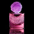 Pink and purple glass with ice sculpture on a black background