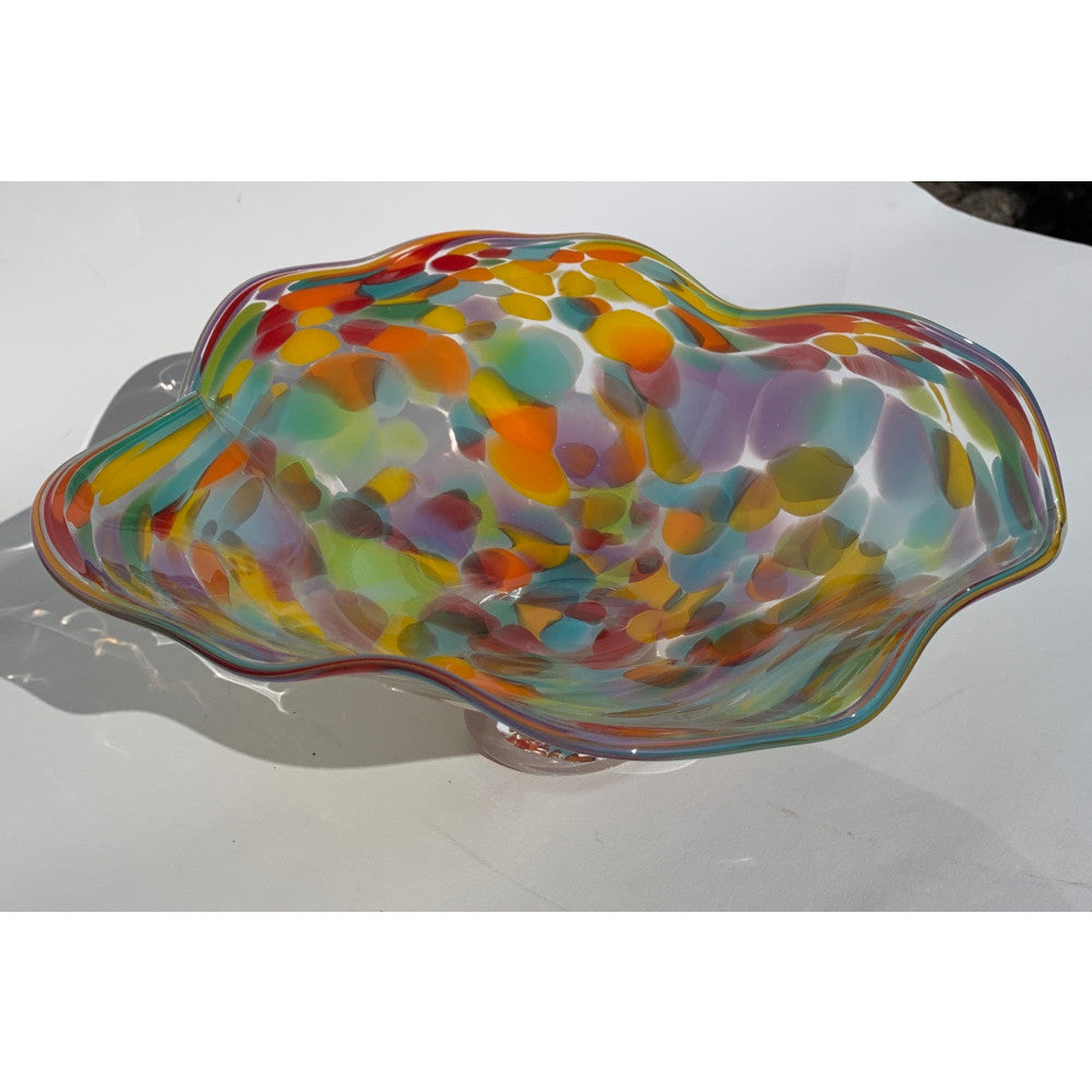 Multicolored glass bowl on a white surface