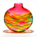 Colorful glass vase with swirl pattern on a white background