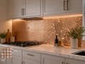 Modern kitchen with copper penny tile backsplash and marble countertop.