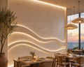 Modern restaurant interior with wavy wall design and ocean view