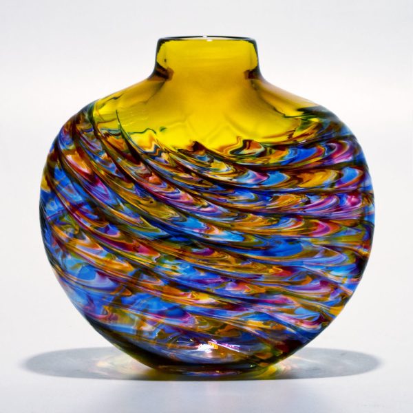 Multicolored glass vase with swirling patterns on a white background