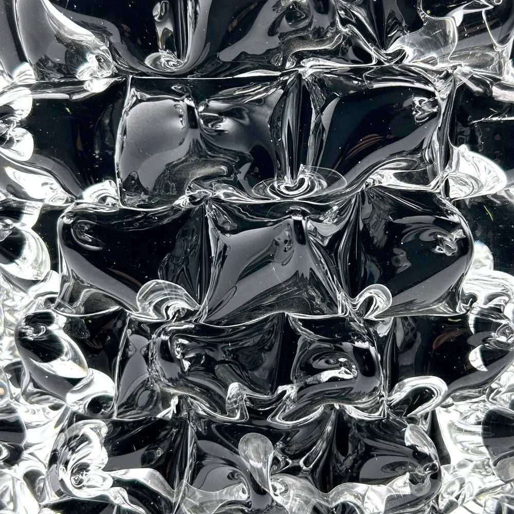 Close-up of a reflective, metallic surface with crumpled texture