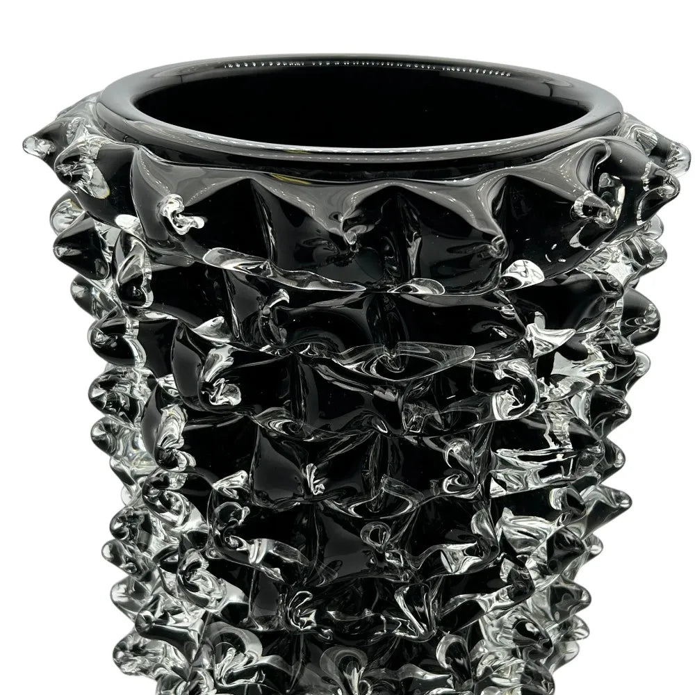 Black textured vase on a white background