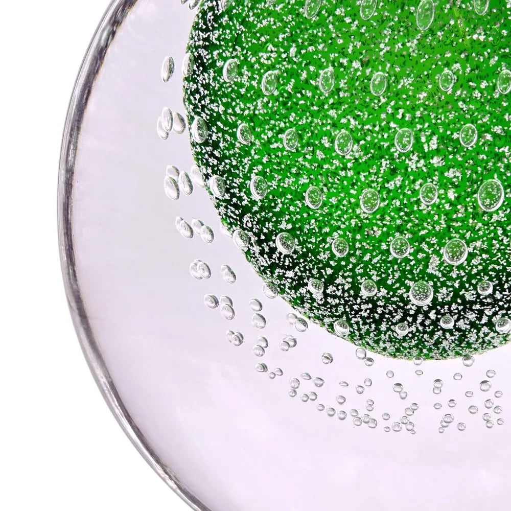 Close-up of a green gel with bubbles on a white background